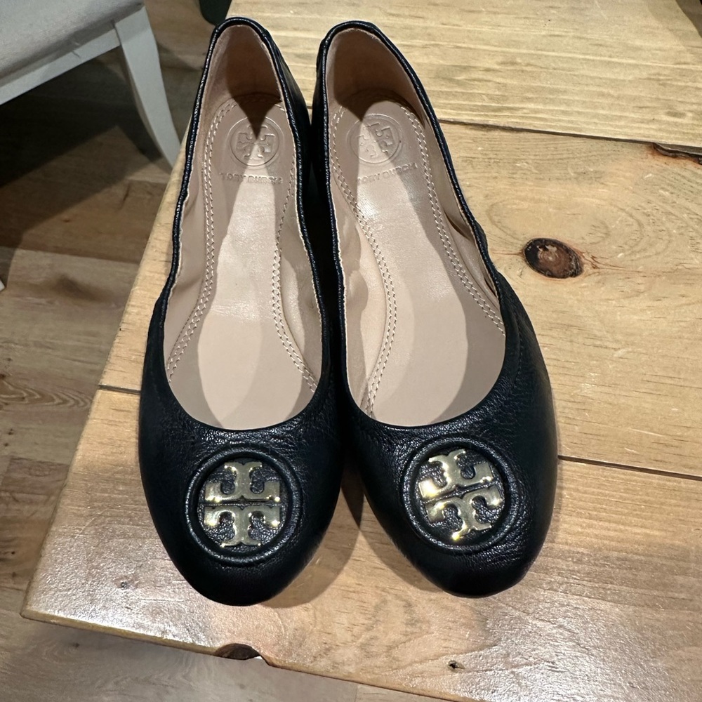 Tory Burch black and gold flats.
